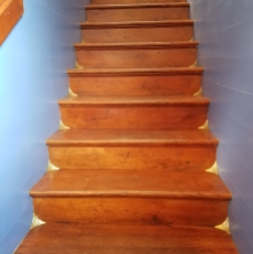 Refinished Steps and Shiny Brass Corners